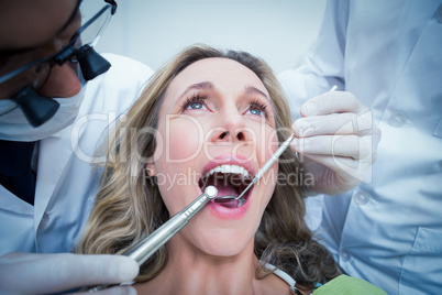 Close up of woman having her teeth examined