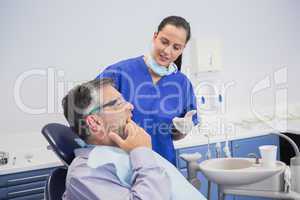 Dentist talking with her patient