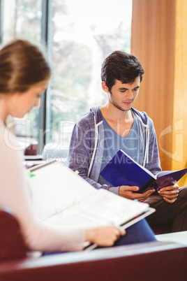 Students sitting on couch revising