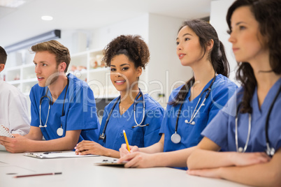 Medical student smiling at the camera during class