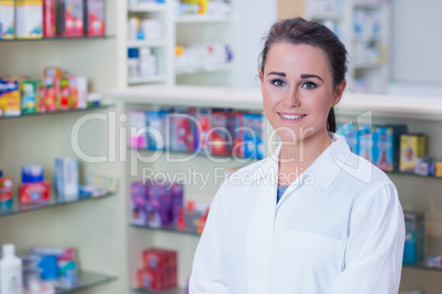 Portrait of a smiling student in lab coat looking at camera