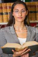 Lawyer reading book in the law library