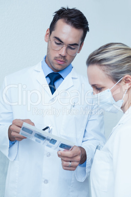 Dentists looking at x-ray