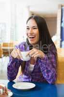 Young students having coffee together