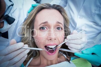 Close up of woman having her teeth examined