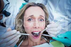 Close up of woman having her teeth examined