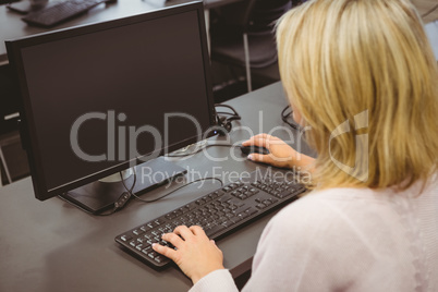 Mature student looking at computer screen