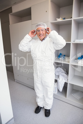 Pharmacist putting on his hairnet