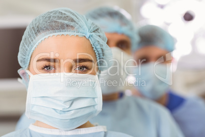 Team of surgeons looking at camera