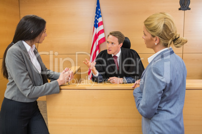 Lawyers speaking with the judge
