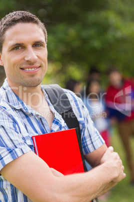 Happy student smiling at camera outside on campus