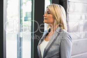 Blonde businesswoman waiting for someone