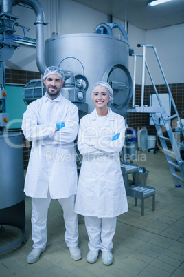 Food technicians smiling at camera