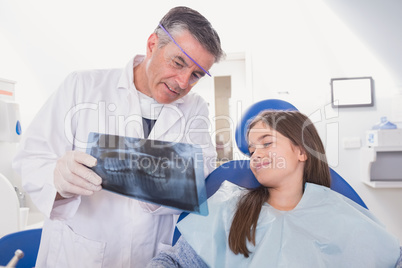 Pediatric dentist explaining to young patient the x-ray Pediatric dentist explaining to young patient the x-ray