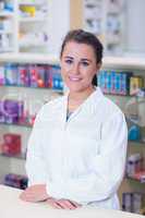 Portrait of a smiling student in lab coat looking at camera