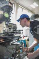 Engineering student using large drill