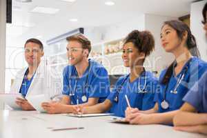 Medical student smiling at the camera during class