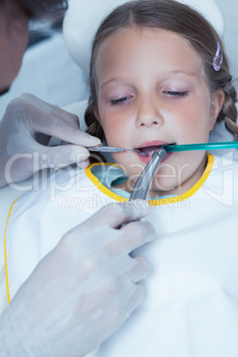 Close up of girl having her teeth examined