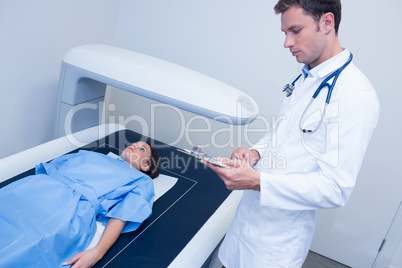 Focused doctor doing a radiography on a patient