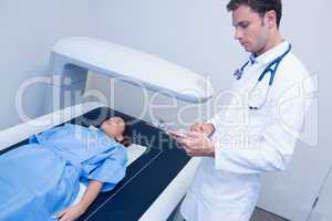 Focused doctor doing a radiography on a patient