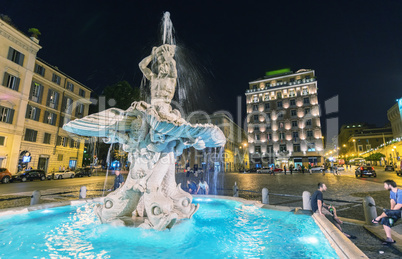 ROME - MAY 23, 2014: Tourists walk in Piazza del Tritone. More t