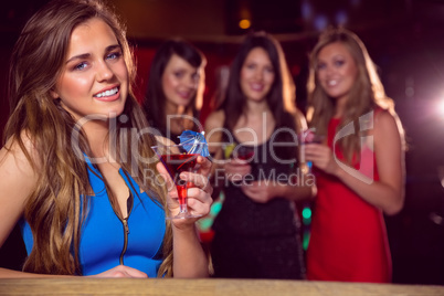 Pretty blonde drinking a cocktail