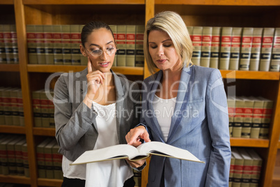 Lawyers talking in the law library