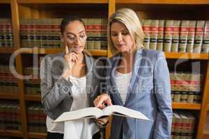 Lawyers talking in the law library