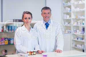 Pharmacist and his trainee looking at the camera