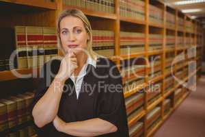 Serious lawyer thinking with hand on chin
