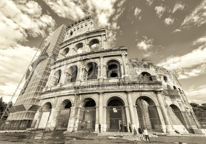 Water reflections of Colosseum with blue sky, Rome