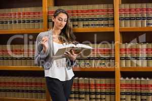 Pretty lawyer reading in the law library