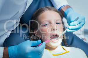 Close up of girl having her teeth examined