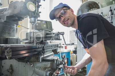 Engineering student using large drill