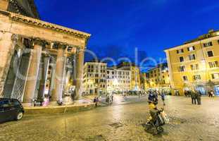 ROME - MAY 18, 2014: Tourists walk in Pantheon Square at night.