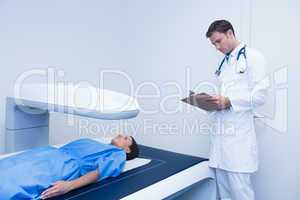 Focused doctor doing a radiography on a patient