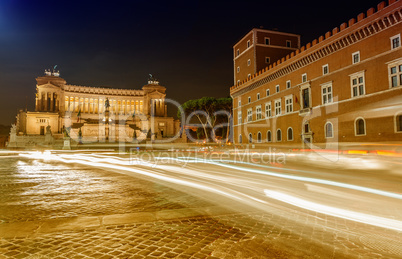 Car light trails in Venice Square at night, Rome