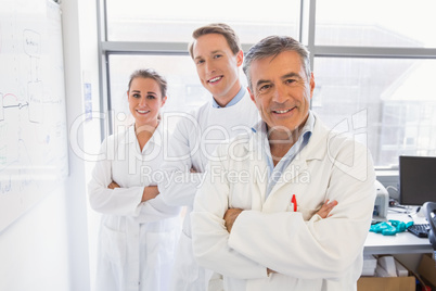 Science students and lecturer smiling at camera