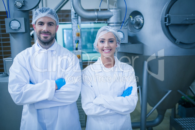 Food technicians smiling at camera
