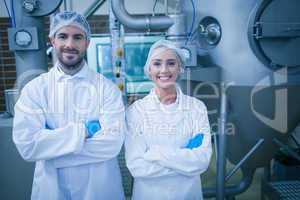 Food technicians smiling at camera