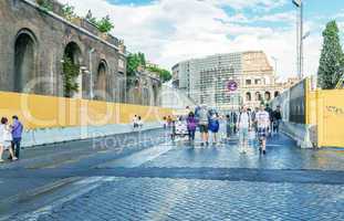 ROME - MAY 18, 2014: Tourists walk near Colosseum. More than 15