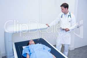 Patient is lying on the x-ray machine