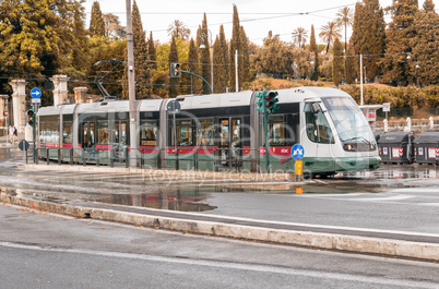 ROME - MAY 14, 2014: ATAC train speeds up in city cente. ATAC is