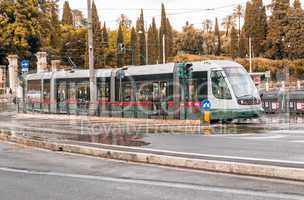 ROME - MAY 14, 2014: ATAC train speeds up in city cente. ATAC is