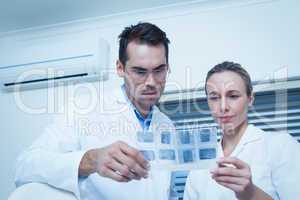 Dentists looking at x-ray