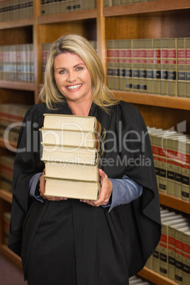 Lawyer holding books in the law library