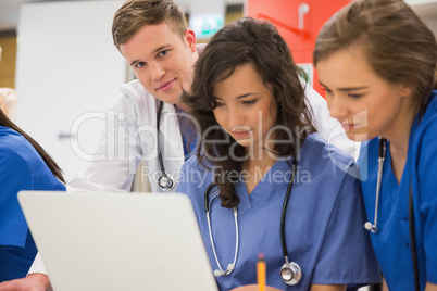 Medical student smiling at the camera during class