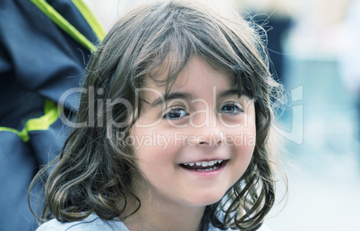 Smiling baby girl on the stroller