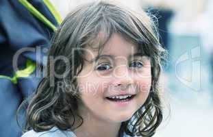 Smiling baby girl on the stroller