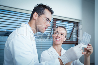 Dentists looking at x-ray